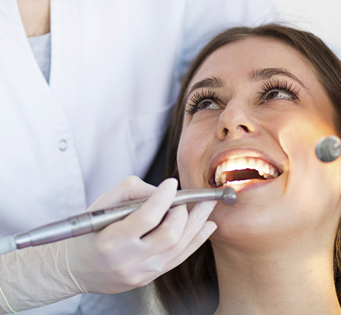 Close up view of young adult woman that have a visit in the dentist clinic. Conception of stomatology